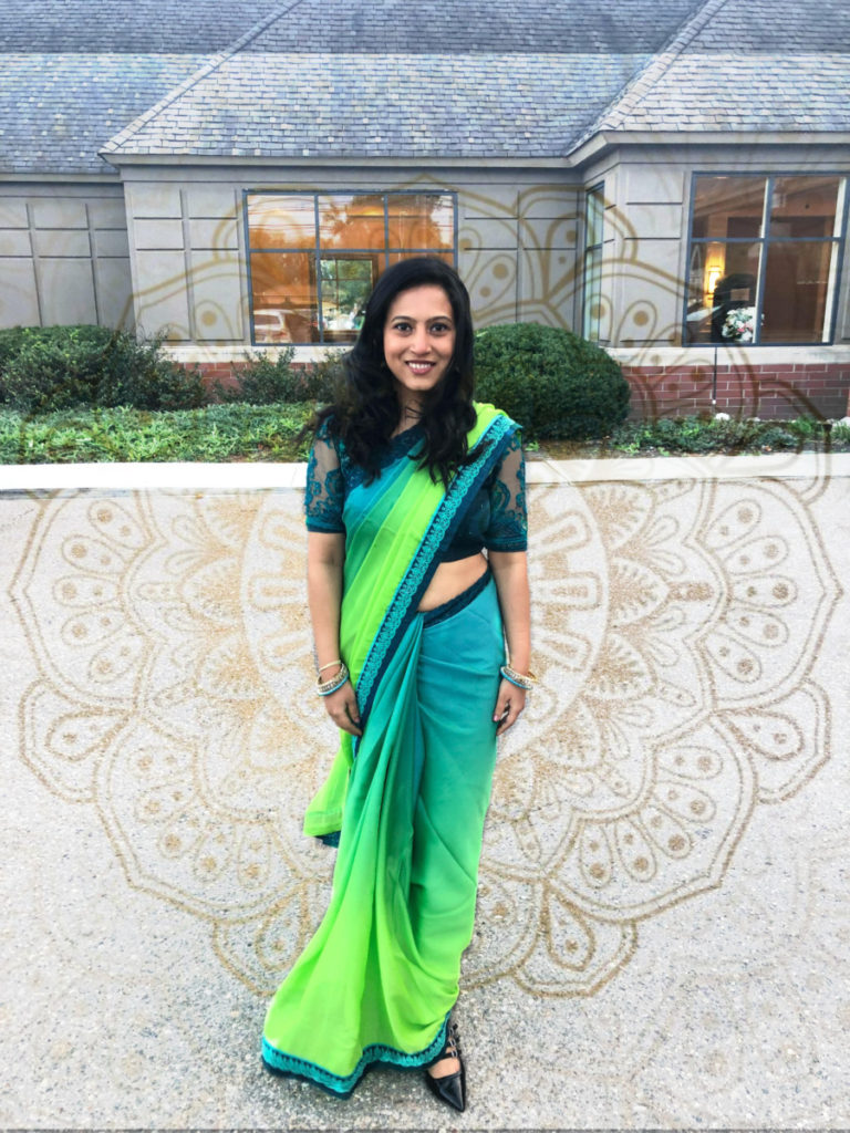 Indian Fashion: Lady standing in a ombre blue green sari, traditional indian wear
